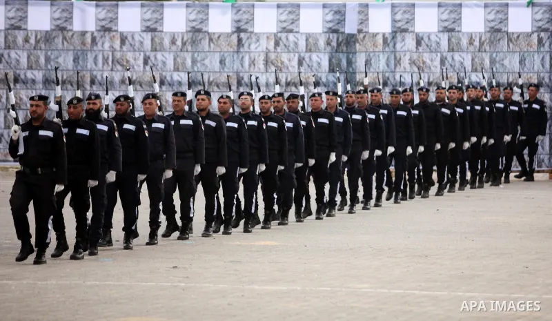 Palestinian policemen march during a graduation ceremony in Gaza City on January 21, 2017. Photo by Ashraf Amra