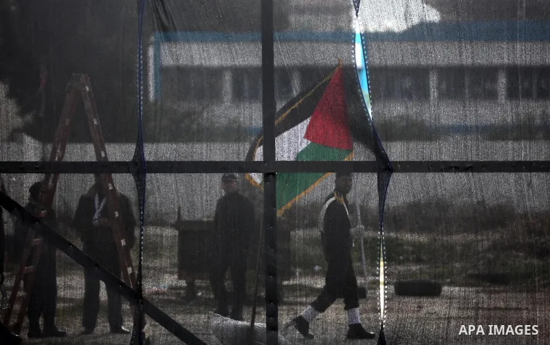 Palestinian policemen march during a graduation ceremony in Gaza City on January 21, 2017. Photo by Ashraf Amra