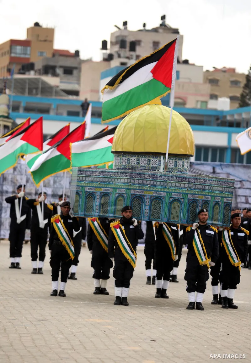 Palestinian policemen march during a graduation ceremony in Gaza City on January 21, 2017. Photo by Ashraf Amra