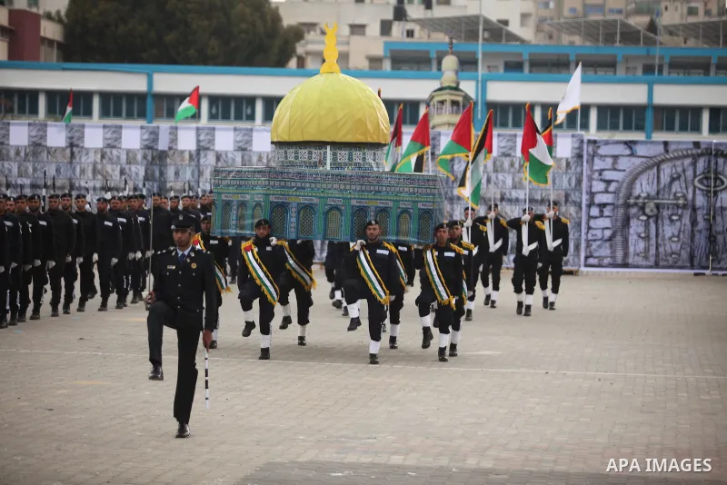 Palestinian policemen march during a graduation ceremony in Gaza City on January 21, 2017. Photo by Ashraf Amra