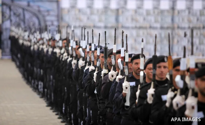 Palestinian policemen march during a graduation ceremony in Gaza City on January 21, 2017. Photo by Ashraf Amra