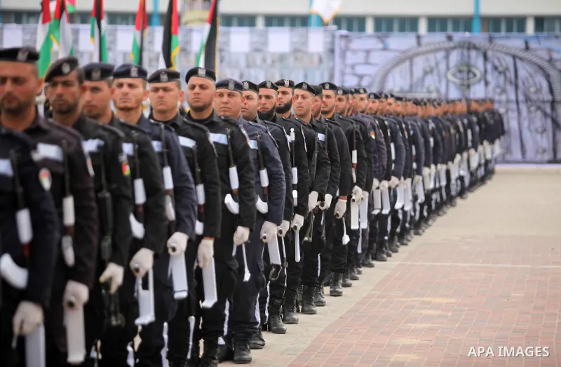 Palestinian policemen march during a graduation ceremony in Gaza City on January 21, 2017. Photo by Ashraf Amra