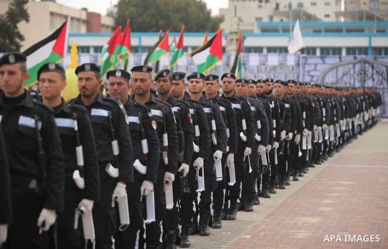 Palestinian policemen march during a graduation ceremony in Gaza City on January 21, 2017. Photo by Ashraf Amra