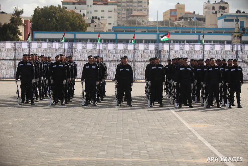 Palestinian policemen march during a graduation ceremony in Gaza City on January 21, 2017. Photo by Ashraf Amra