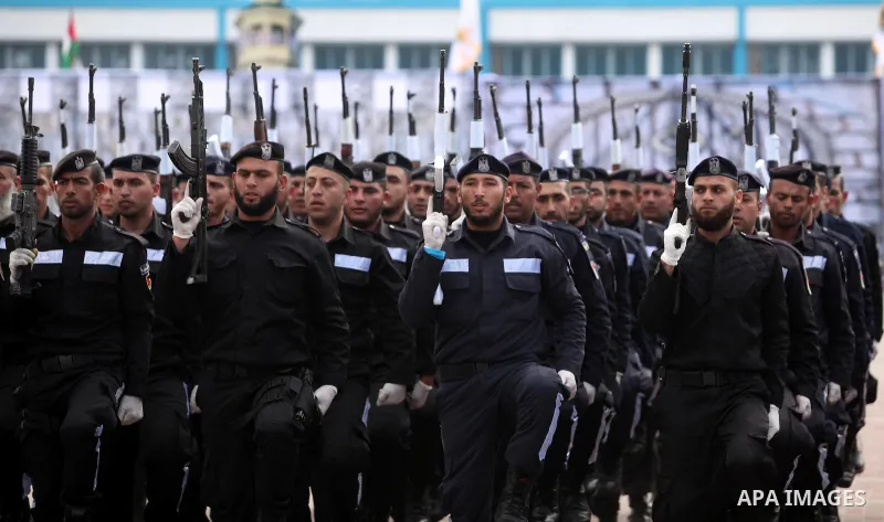 Palestinian policemen march during a graduation ceremony in Gaza City on January 21, 2017. Photo by Ashraf Amra