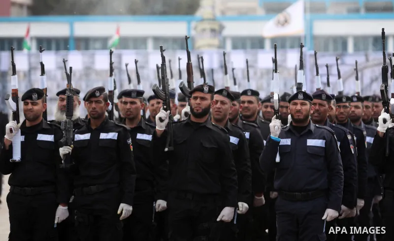 Palestinian policemen march during a graduation ceremony in Gaza City on January 21, 2017. Photo by Ashraf Amra