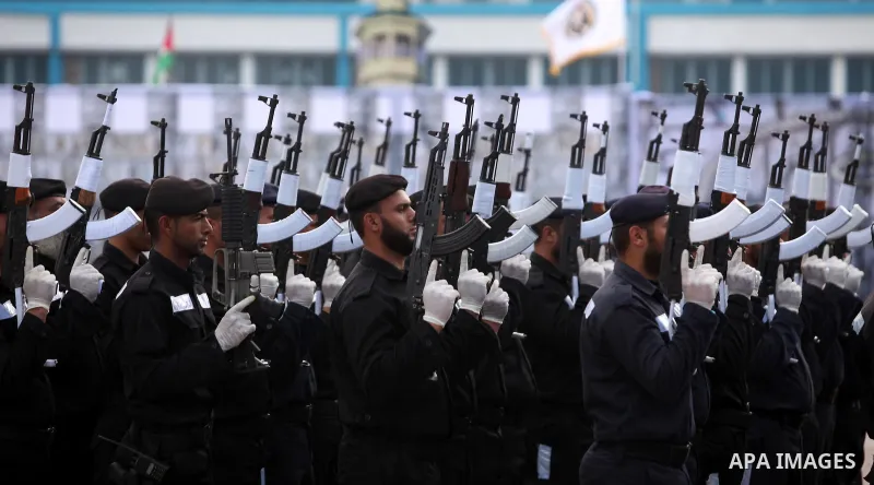 Palestinian policemen march during a graduation ceremony in Gaza City on January 21, 2017. Photo by Ashraf Amra