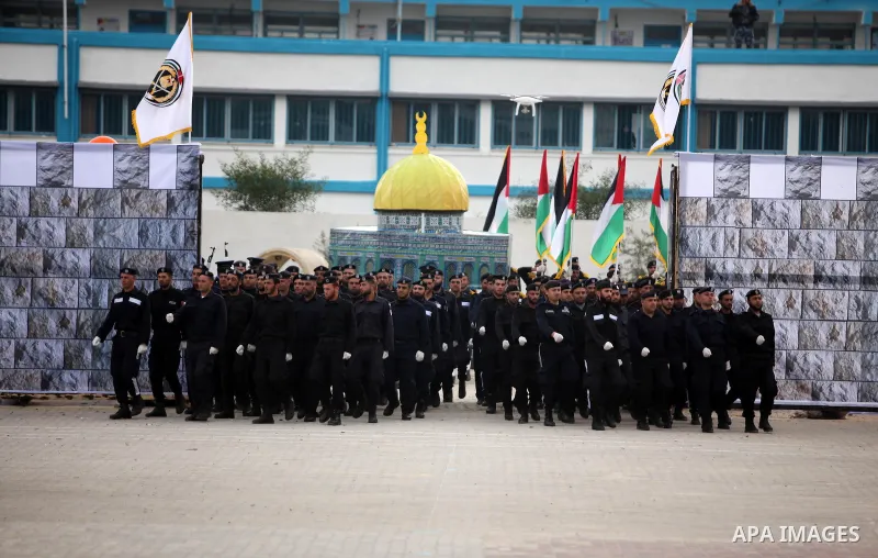 Palestinian policemen march during a graduation ceremony in Gaza City on January 21, 2017. Photo by Ashraf Amra