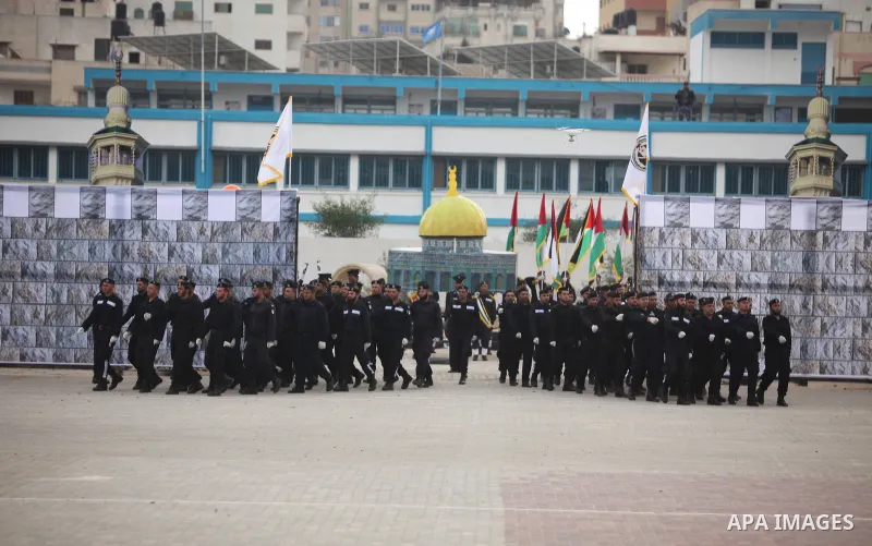 Palestinian policemen march during a graduation ceremony in Gaza City on January 21, 2017. Photo by Ashraf Amra
