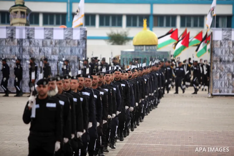 Palestinian policemen march during a graduation ceremony in Gaza City on January 21, 2017. Photo by Ashraf Amra