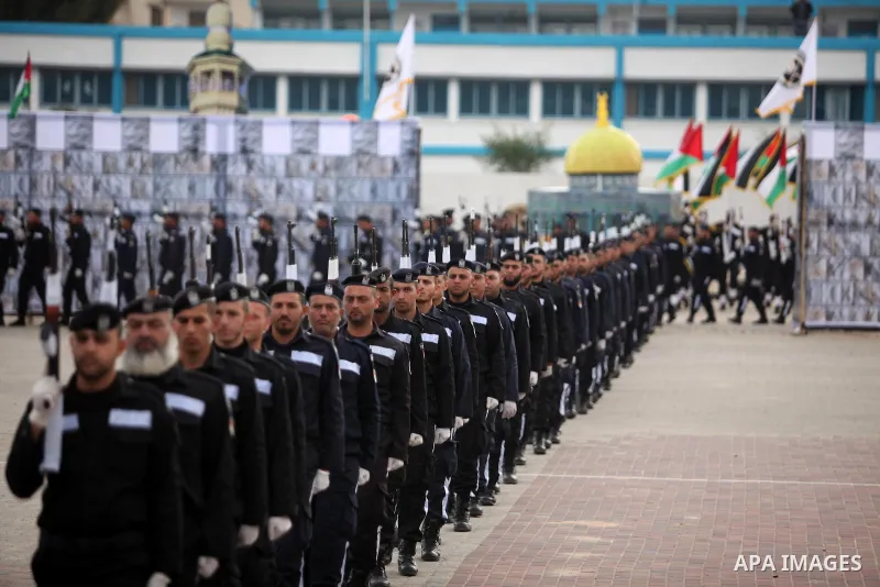 Palestinian policemen march during a graduation ceremony in Gaza City on January 21, 2017. Photo by Ashraf Amra