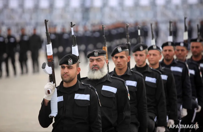 Palestinian policemen march during a graduation ceremony in Gaza City on January 21, 2017. Photo by Ashraf Amra