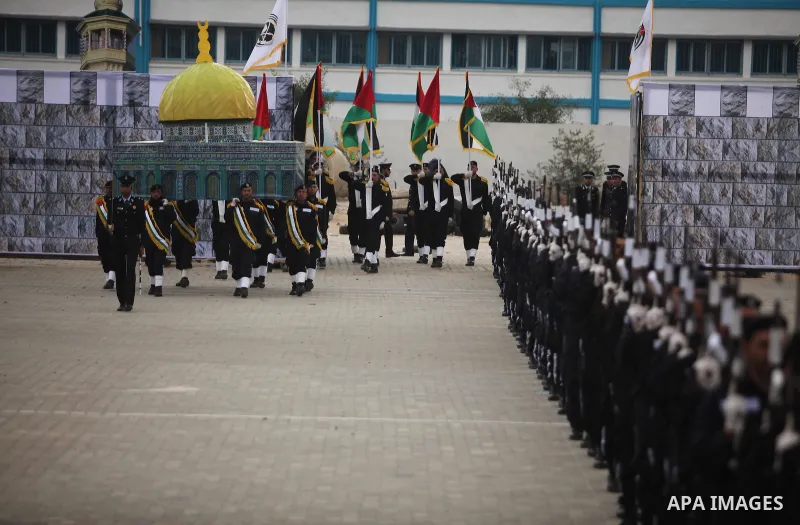Palestinian policemen march during a graduation ceremony in Gaza City on January 21, 2017. Photo by Ashraf Amra