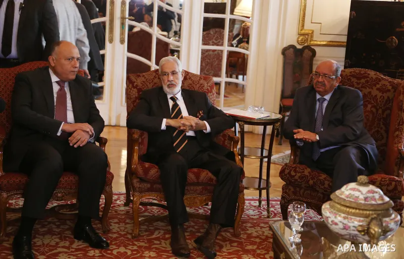 Egyptian Foreign Minister Sameh Shoukry, Libyan foreign minister in the government of national reconciliation, Mohamed Tahar Siala, and Algerian Minister of Maghreb Affairs, Abdelkader Messahel, chat during a meeting ove...