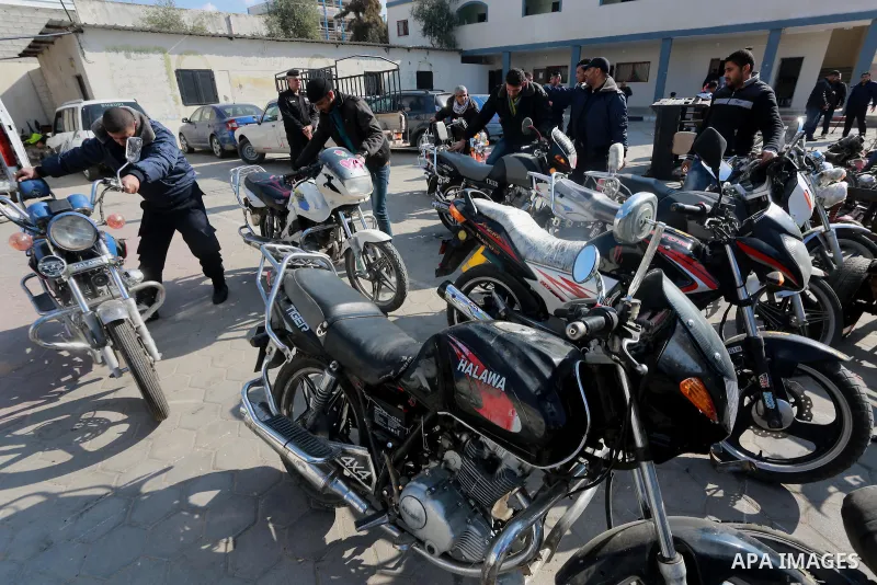 Palestinian policemen prepare illegal motorcycles before destroy it in Gaza city on January 22, 2017. According to Palestinian traffic police more than 70 motorcycle and 1500 Gas device will be destroyed. Photo by Mohamm...