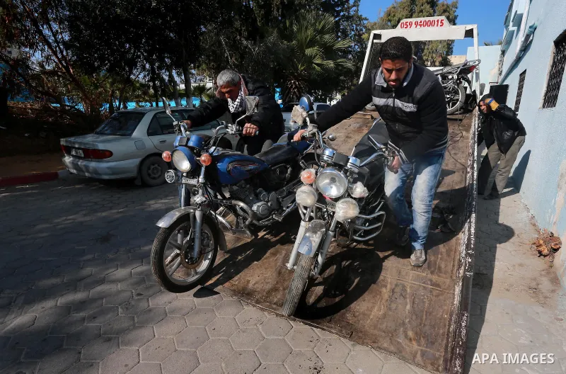 Palestinian policemen prepare illegal motorcycles before destroy it in Gaza city on January 22, 2017. According to Palestinian traffic police more than 70 motorcycle and 1500 Gas device will be destroyed. Photo by Mohamm...