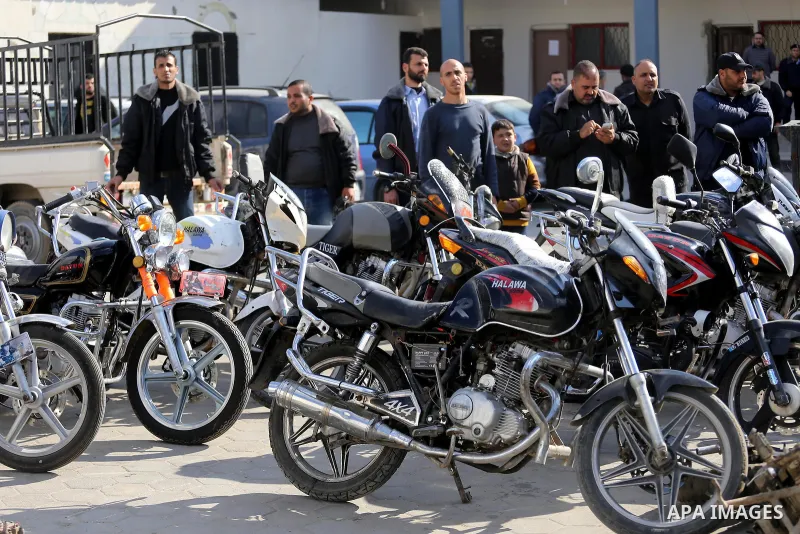 Palestinian policemen prepare illegal motorcycles before destroy it in Gaza city on January 22, 2017. According to Palestinian traffic police more than 70 motorcycle and 1500 Gas device will be destroyed. Photo by Mohamm...