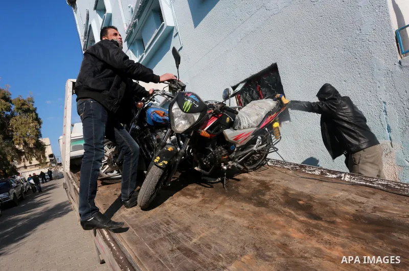 Palestinian policemen prepare illegal motorcycles before destroy it in Gaza city on January 22, 2017. According to Palestinian traffic police more than 70 motorcycle and 1500 Gas device will be destroyed. Photo by Mohamm...