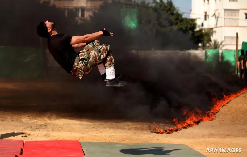 Members of Palestinian National Security Forces loyal to Hamas demonstrate their skills during a military graduation ceremony, in Gaza City January 22, 2017. Photo by Ashraf Amra