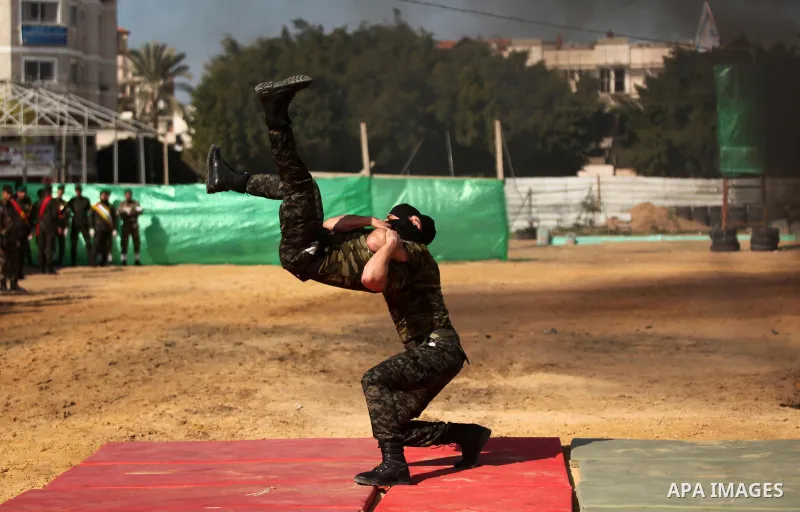 Members of Palestinian National Security Forces loyal to Hamas demonstrate their skills during a military graduation ceremony, in Gaza City January 22, 2017. Photo by Ashraf Amra