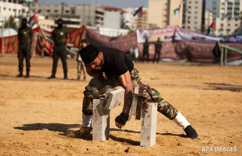 Members of Palestinian National Security Forces loyal to Hamas demonstrate their skills during a military graduation ceremony, in Gaza City January 22, 2017. Photo by Ashraf Amra