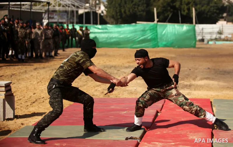 Members of Palestinian National Security Forces loyal to Hamas demonstrate their skills during a military graduation ceremony, in Gaza City January 22, 2017. Photo by Ashraf Amra