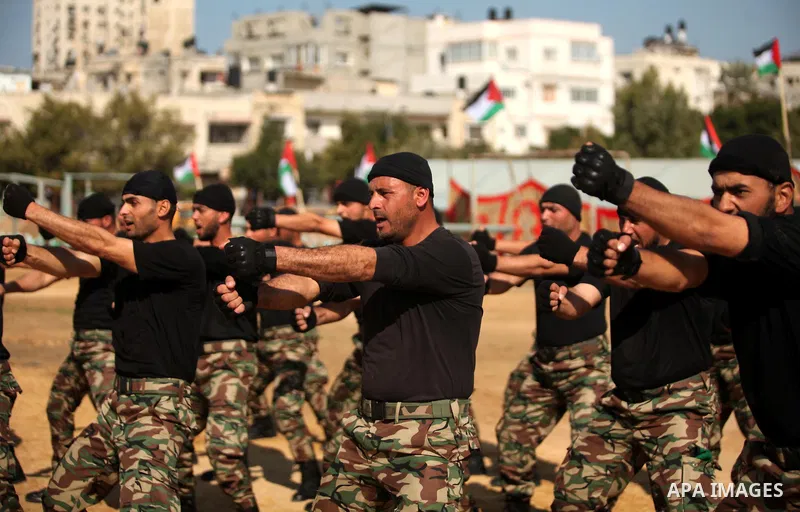 Members of Palestinian National Security Forces loyal to Hamas demonstrate their skills during a military graduation ceremony, in Gaza City January 22, 2017. Photo by Ashraf Amra