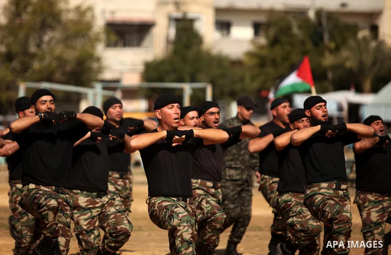 Members of Palestinian National Security Forces loyal to Hamas demonstrate their skills during a military graduation ceremony, in Gaza City January 22, 2017. Photo by Ashraf Amra