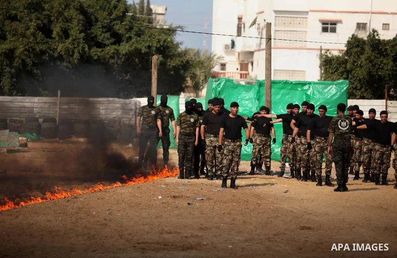 Members of Palestinian National Security Forces loyal to Hamas demonstrate their skills during a military graduation ceremony, in Gaza City January 22, 2017. Photo by Ashraf Amra