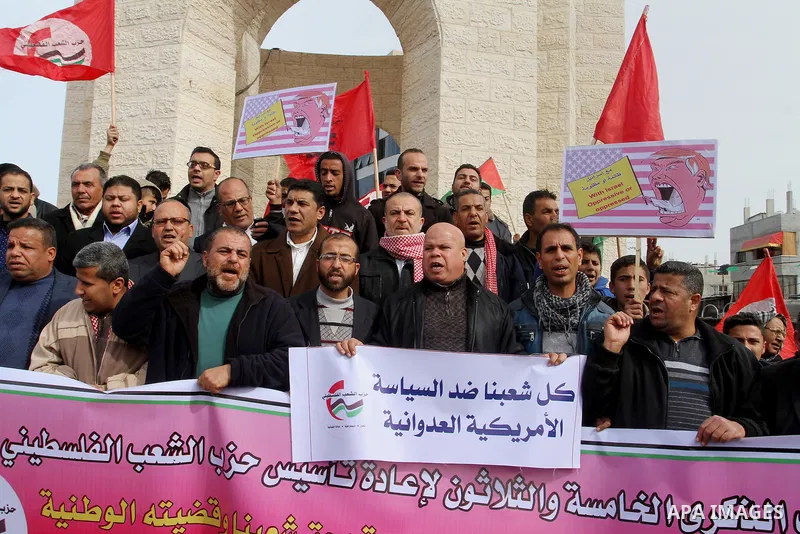 Palestinian protestors take part in a demonstration against US President Donald Trump's pledge to move his country's embassy to Jerusalem, in Rafah in the southern Gaza Strip on January 24, 2017. Trump has pledged strong...