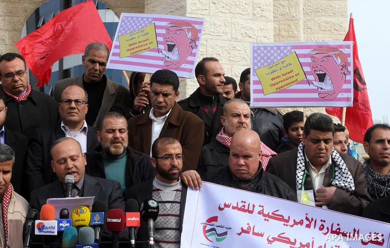 Palestinian protestors take part in a demonstration against US President Donald Trump's pledge to move his country's embassy to Jerusalem, in Rafah in the southern Gaza Strip on January 24, 2017. Trump has pledged strong...