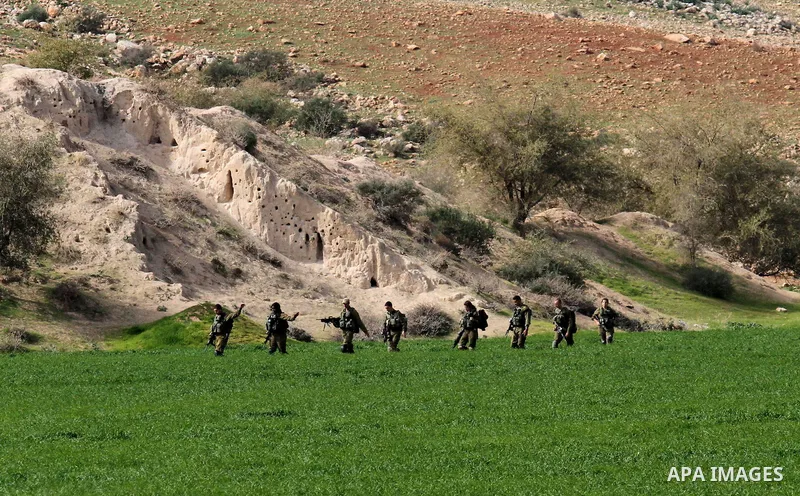 Israeli soldiers take part in a military training near Jeftlek village near Jordan Valley in the West Bank, on January 24, 2017. Photo by Nedal Eshtayah