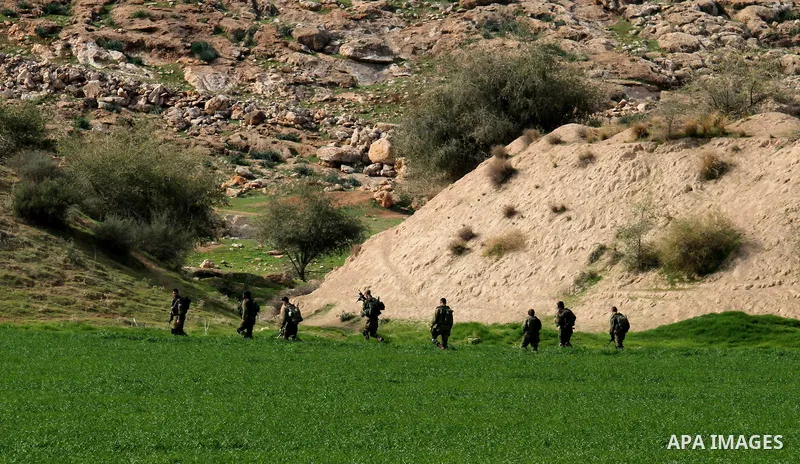 Israeli soldiers take part in a military training near Jeftlek village near Jordan Valley in the West Bank, on January 24, 2017. Photo by Nedal Eshtayah