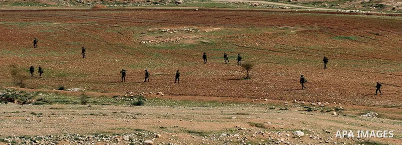 Israeli soldiers take part in a military training near Jeftlek village near Jordan Valley in the West Bank, on January 24, 2017. Photo by Nedal Eshtayah