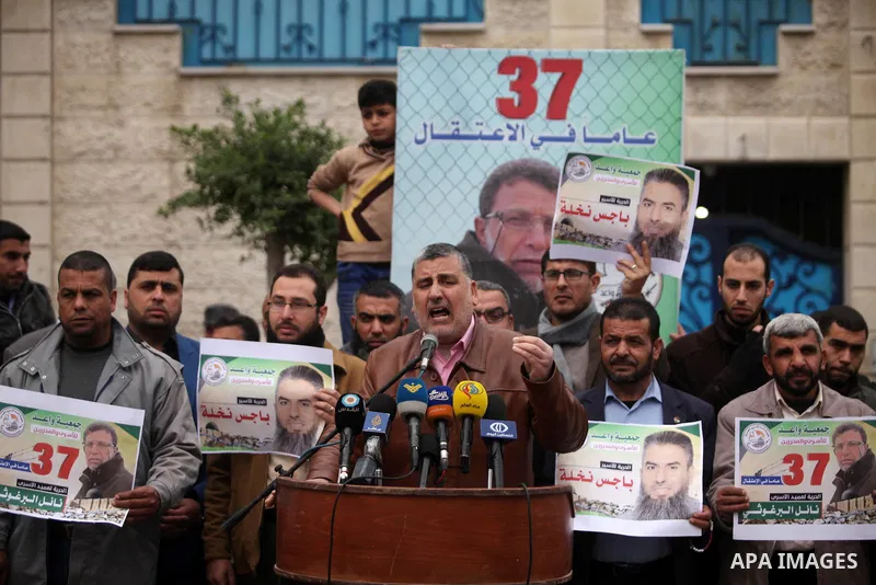 Leader of the Islamic Jihad Ahmed Al-Modallal speaks during a protest to show solidarity with Palestinian prisoners in Israeli jails, in front of the high commissioner for human rights headquarters, in Gaza city, on Janu...