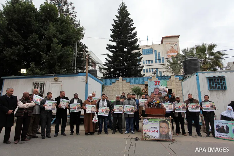 Leader of the Islamic Jihad Ahmed Al-Modallal speaks during a protest to show solidarity with Palestinian prisoners in Israeli jails, in front of the high commissioner for human rights headquarters, in Gaza city, on Janu...