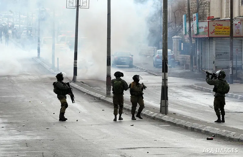 Israeli security forces take position during clashes with Palestinian protesters following a demonstration demanding that Israeli authorities return the bodies of Palestinians killed during attacks on Israel, in the West...