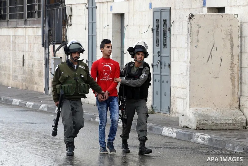 Israeli border policemen detain a Palestinian during clashes following a demonstration demanding that Israeli authorities return the bodies of Palestinians killed during attacks on Israel, in the West Bank town of Bethle...