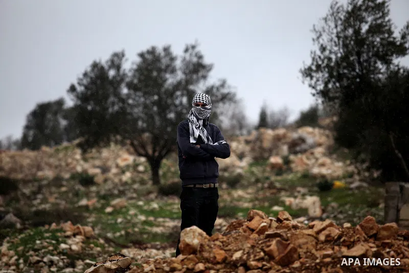 A Palestinian protester takes part in a weekly demonstration against the expropriation of Palestinian land by Israel in the village of Kfar Qaddum, near Nablus, in the occupied West Bank on January 27, 2017. Photo by Ned...
