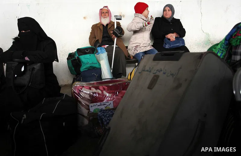 Palestinians wait for travel permits to cross into Egypt through the Rafah border crossing after it was opened by Egyptian authorities for humanitarian cases, in Rafah in the southern Gaza Strip January 28, 2017. Photo b...