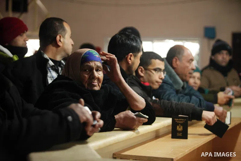 Palestinians wait for travel permits to cross into Egypt through the Rafah border crossing after it was opened by Egyptian authorities for humanitarian cases, in Rafah in the southern Gaza Strip January 28, 2017. Photo b...