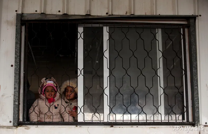 Palestinians wait for travel permits to cross into Egypt through the Rafah border crossing after it was opened by Egyptian authorities for humanitarian cases, in Rafah in the southern Gaza Strip January 28, 2017. Photo b...