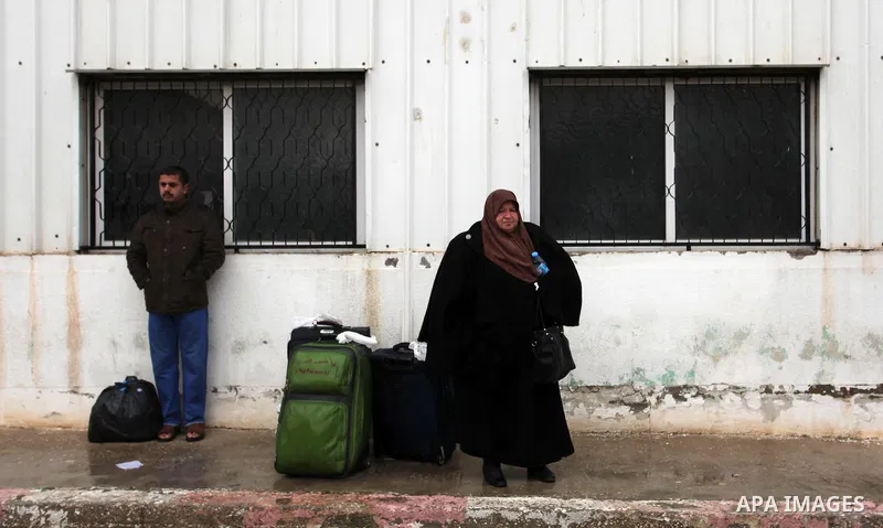 Palestinians wait for travel permits to cross into Egypt through the Rafah border crossing after it was opened by Egyptian authorities for humanitarian cases, in Rafah in the southern Gaza Strip January 28, 2017. Photo b...