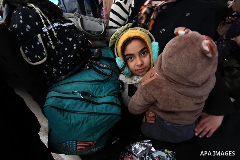 Palestinians wait for travel permits to cross into Egypt through the Rafah border crossing after it was opened by Egyptian authorities for humanitarian cases, in Rafah in the southern Gaza Strip January 28, 2017. Photo b...