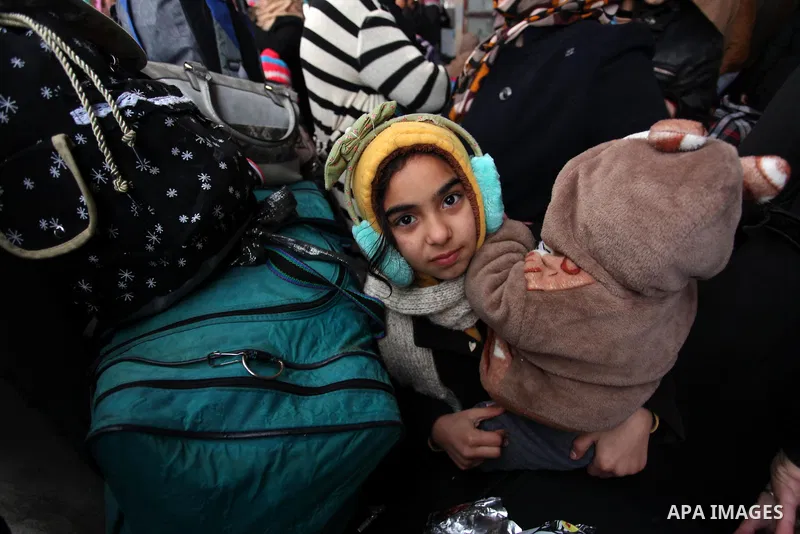 Palestinians wait for travel permits to cross into Egypt through the Rafah border crossing after it was opened by Egyptian authorities for humanitarian cases, in Rafah in the southern Gaza Strip January 28, 2017. Photo b...