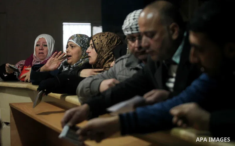 Palestinians wait for travel permits to cross into Egypt through the Rafah border crossing after it was opened by Egyptian authorities for humanitarian cases, in Rafah in the southern Gaza Strip January 28, 2017. Photo b...