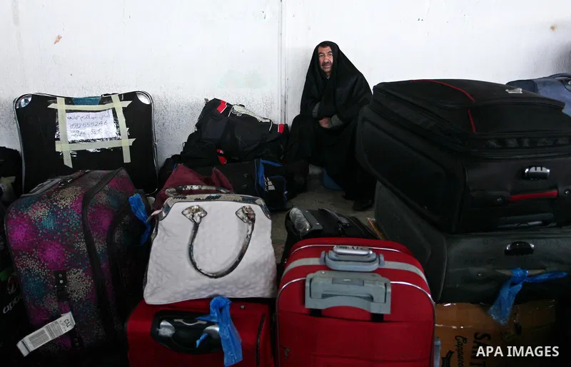 Palestinians wait for travel permits to cross into Egypt through the Rafah border crossing after it was opened by Egyptian authorities for humanitarian cases, in Rafah in the southern Gaza Strip January 28, 2017. Photo b...