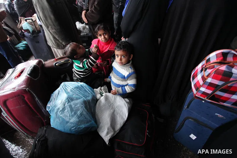 Palestinians wait for travel permits to cross into Egypt through the Rafah border crossing after it was opened by Egyptian authorities for humanitarian cases, in Rafah in the southern Gaza Strip January 28, 2017. Photo b...