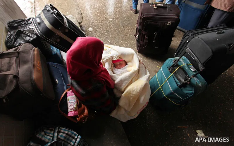 Palestinians wait for travel permits to cross into Egypt through the Rafah border crossing after it was opened by Egyptian authorities for humanitarian cases, in Rafah in the southern Gaza Strip January 28, 2017. Photo b...