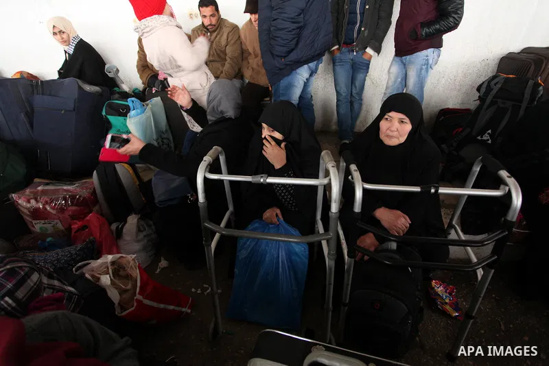 Palestinians wait for travel permits to cross into Egypt through the Rafah border crossing after it was opened by Egyptian authorities for humanitarian cases, in Rafah in the southern Gaza Strip January 28, 2017. Photo b...